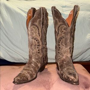 Brown Dan Post studded cowboy boots.